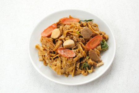Photo for Kwetiaw or Kwetiau, fried rice noodles with meatballs and vegetables. Popular in Indonesia - Royalty Free Image