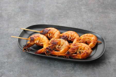 Photo for Udang Bakar Madu, Grilled Shrimp with honey, made from shrimp seasoned with chilli sauce, pepper and honey - Royalty Free Image