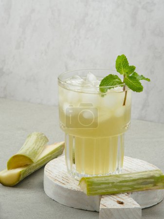 Fresh sugar cane juice (Es Tebu) in glass. Indonesian drink.