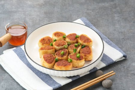 Photo for Gohyong or Ngo Hiang, made from minced chicken with flour, served with sour sauce - Royalty Free Image