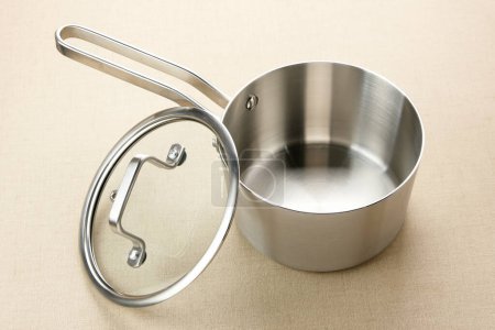 Stainless steel saucepan with glass lid