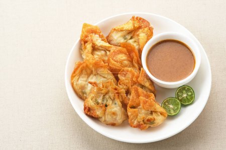 Batagor, made from fish or chicken dumpling, tofu, tapioca flour served with peanut sauce. Indonesian food