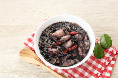 Squid Black Soup (Tumis Cumi Hitam) or stir-fried squid in black ink, Indonesian traditional food