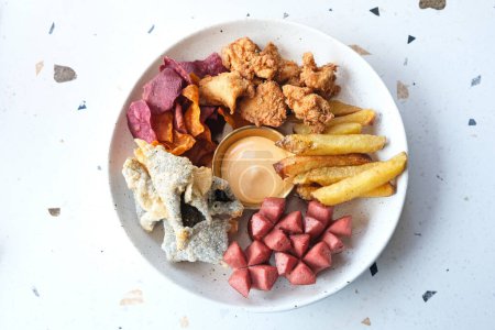 Mix Platter, a plate of snacks containing french fries, sausages, chicken karaage with mayonnaise sauce
