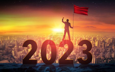 Photo for Businessman Standing And Holding Red Flag. Concept For Success In 2023 - Royalty Free Image