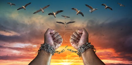 Photo for Hands in fists breaking a chain freedom. The concept of gaining freedom. - Royalty Free Image