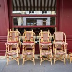 Rattan Chairs Stacked in Front of a Restaurant