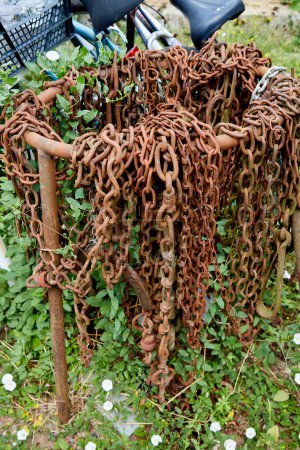 Rusty Chains Hanging on a Metal Loop