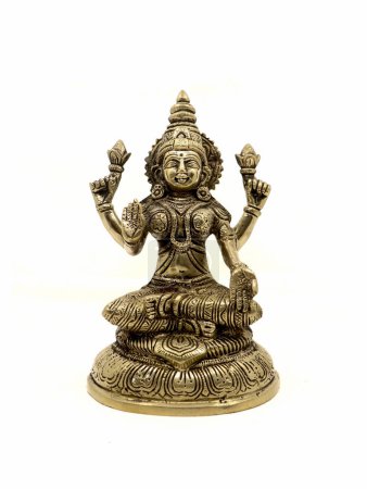 Photo for Hindu goddess mahalakshmi antique idol with four hands, front view isolated in a white background - Royalty Free Image