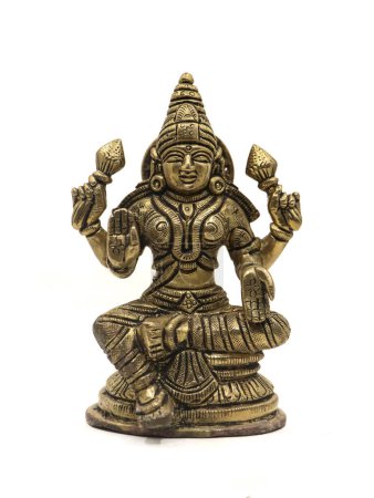 Photo for Hindu goddess mahalakshmi antique idol with four hands, front view isolated in a white background - Royalty Free Image