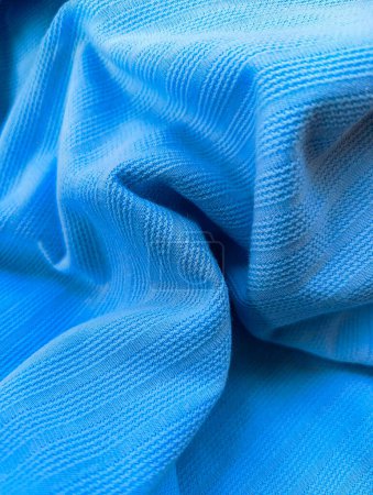 Texture de tissu de vêtements bleus ou tissu ou fil de sport gros plan fond textile. 