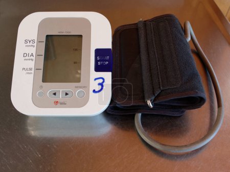 An arm cuff blood pressure gauge, or sphygmomanometer which uses an aneroid manometer to measure the pressure