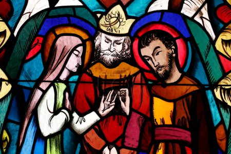 Téléchargez les photos : Saint Joseph des Fins church.  The marriage of the Virgin Mary and Saint Joseph. Stained glass window.  Annecy. France. - en image libre de droit