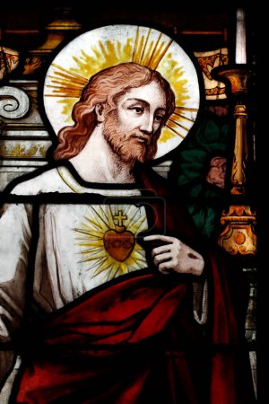 Foto de Nantua abbey. Stained glass window.  Jesus Sacred heart.  Nantua. France. - Imagen libre de derechos