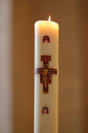 Paschal candle is blessed and lit every year at Easter. Tournus. France. 