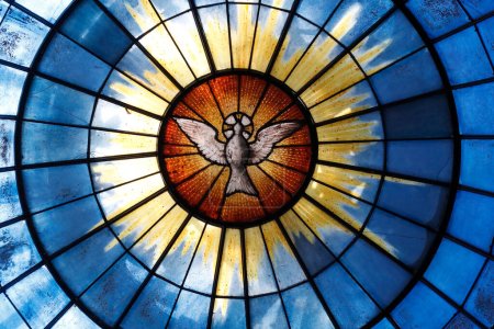 Foto de The Royal Chapel of Dreux.  Gothic glass by the Sevres porcelain manufactory. Pentecost. The pentecostal dove (representing Holy Spirit). Dreux. France. - Imagen libre de derechos