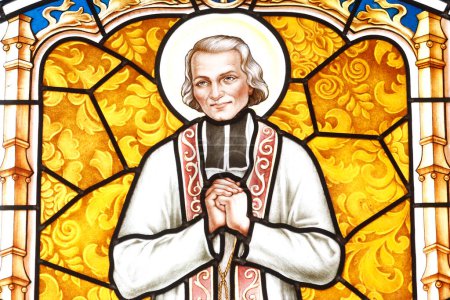 Photo for Saint John Vianney ( cure d'Ars). is venerated in the Catholic Church as a saint and as the patron saint of parish priests.  Stained glass window. Thi Nghe Church.  Ho Chi Minh City. Vietnam. - Royalty Free Image