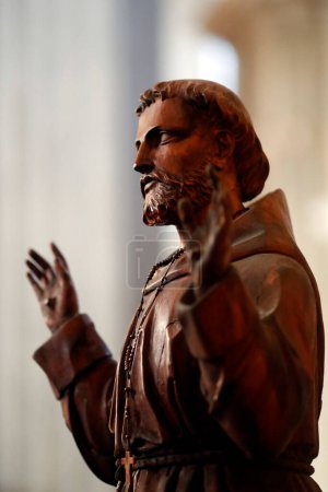 Sallanches church. Francis of Assisi statue.  France.