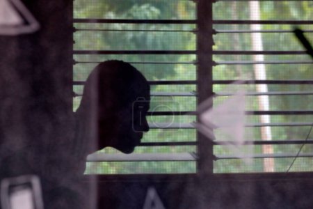 Téléchargez les photos : African man in his house.  Lome. Togo. - en image libre de droit