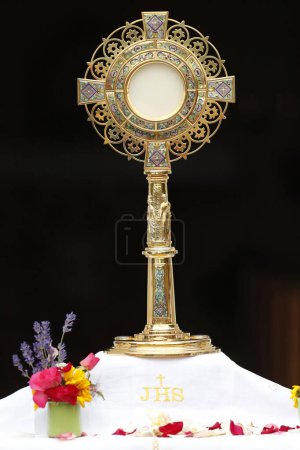 Photo for Corpus Christi or Feast of the Blessed Sacrament.  Eucharistic adoration.  La Roche sur Foron. France. - Royalty Free Image