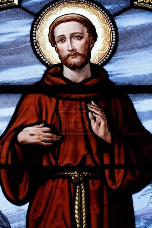 Photo for Saint Cyr and Sainte Julitte church.  Stained glass window.  Saint Francis of Assisi, also known in his ministry as Francesco. Beaufort. France. - Royalty Free Image