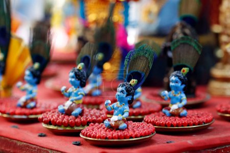 Photo for Religious hindu god statues for sale in spiritual shop.  Figurines of Lord Krishna baby.  Dubai. United Arab Emirates. - Royalty Free Image
