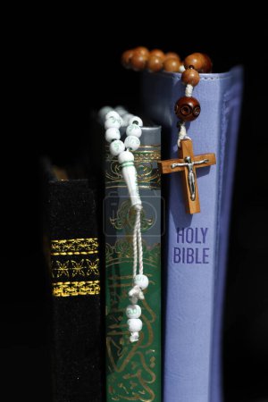 Photo for Christianity and Islam are the two largest religions in the world.  Bible, Quran. Crucifix and prayer beads. Interfaith symbols. - Royalty Free Image