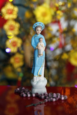 Photo for Virgine Mary figurine and Rosary.  Religion and faith concept. - Royalty Free Image
