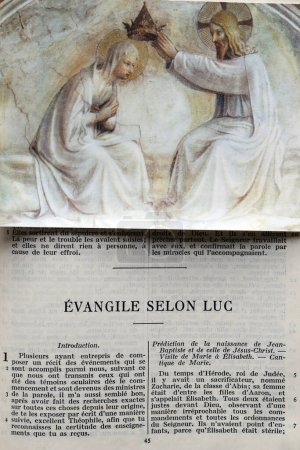 Photo for Open bible in french with religious image. Gospel of Luke. - Royalty Free Image