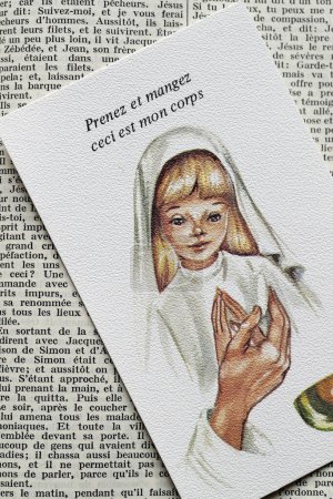 Photo for Open bible in french with religious image.  First Communion. - Royalty Free Image