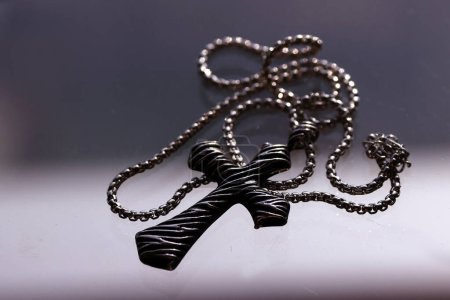 Photo for Silver christianity cross pendant  on a chain. Religious symbol. - Royalty Free Image