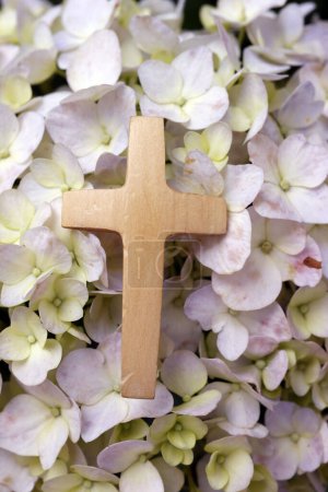Photo for Wooden christian cross on hydrangea flower. Pray in nature. - Royalty Free Image
