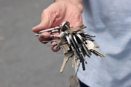 Close up on hand with keys.  Ho Chi Minh city. Vietnam. 