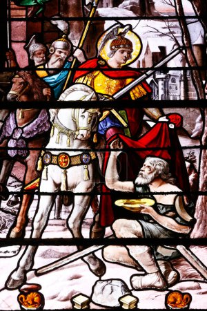 Photo for Saint Martin church.  Stained glass.  Life of Saint Martin. Saint Martin give his coat.  Villiers sur Mer. France. - Royalty Free Image