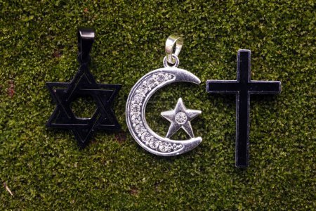 Religious symbols : Jewish Star of David, Muslim Star and Crescent and Catholc Cross. Interreligious, interfaith and spirituality concept