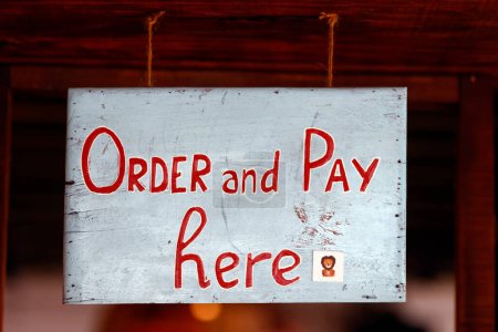 Restaurant. Order and pay here sign. 