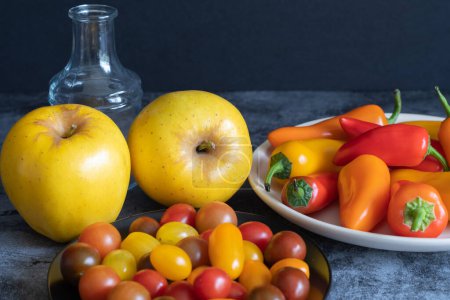 Photo for Opal apples, mini peppers, and cherry tomatoes ready to eat. - Royalty Free Image