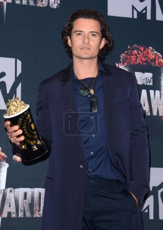 Photo for Orlando Bloom at the 2014 MTV Movie Awards - Press Room held at the Nokia Theatre L.A. Live in Los Angeles, USA on April 13, 2014. - Royalty Free Image