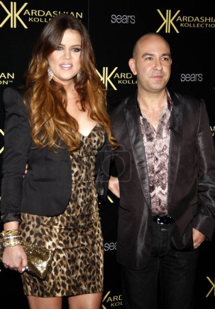 Foto de HOLLYWOOD, CA - AUGUST 17, 2011: Khloe Kardashian and Bruno Schiavi at the Kardashian Kollection Launch Party held at the Colony in Hollywood, USA on August 17, 2011. - Imagen libre de derechos