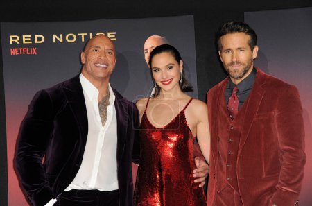Photo for Dwayne Johnson, Gal Gadot and Ryan Reynolds at the World Premiere of Netflix's 'Red Notice' held at the L.A. LIVE in Los Angeles, USA on November 3, 2021. - Royalty Free Image
