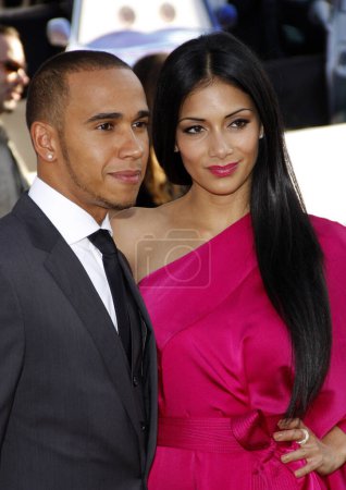 Photo for Nicole Scherzinger and Lewis Hamilton at the Los Angeles premiere of 'Cars 2' held at the El Capitan Theatre in Hollywood, USA on June 18, 2011. - Royalty Free Image