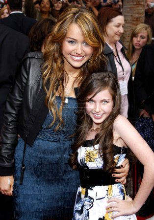 Photo for Miley Cyrus and Ryan Newman at the Los Angeles premiere of 'Hannah Montana The Movie' held at the El Capitan Theater in Hollywood on April 4, 2009. - Royalty Free Image