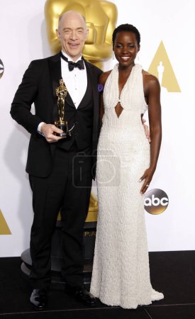 Photo for Lupita Nyong'o and J.K. Simmons at the 87th Annual Academy Awards - Press Room held at the Loews Hollywood Hotel  in Los Angeles on Sunday February 22, 2015. - Royalty Free Image