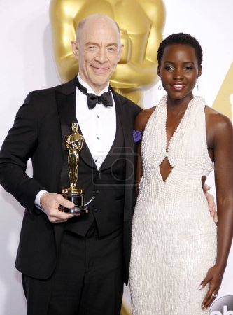 Photo for Lupita Nyong'o and J.K. Simmons at the 87th Annual Academy Awards - Press Room held at the Loews Hollywood Hotel  in Los Angeles on Sunday February 22, 2015. - Royalty Free Image
