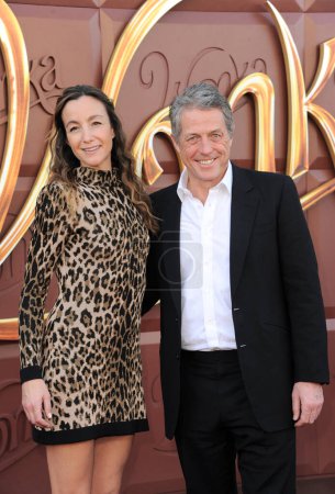 Photo for Anna Elisabet Eberstein and Hugh Grant at the Los Angeles premiere of 'Wonka' held at the Regency Village Theater in Westwood, USA on December 10, 2023. - Royalty Free Image