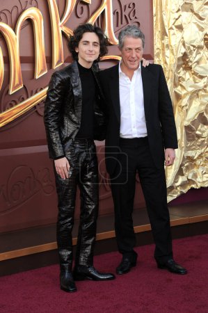 Photo for Timothee Chalamet and Hugh Grant at the Los Angeles premiere of 'Wonka' held at the Regency Village Theater in Westwood, USA on December 10, 2023. - Royalty Free Image