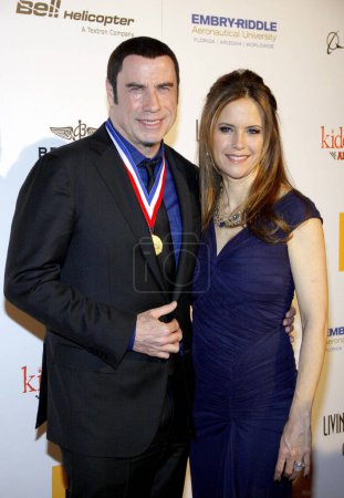 Foto de John Travolta y Kelly Preston en los Living Legends Of Aviation Awards celebrados en el Beverly Hilton Hotel en Los Ángeles, California, Estados Unidos el 18 de enero de 2013. - Imagen libre de derechos