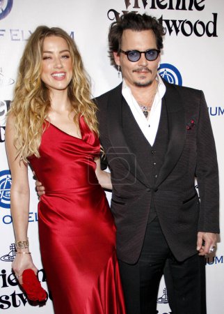 Foto de Amber Heard and Johnny Depp at the Art Of Elysium's 9th Annual Heaven Gala held at the 3LABS in Culver City, USA on January 9, 2016. - Imagen libre de derechos