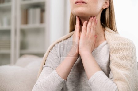Photo for Cropped view of woman hands touching lymph nodes on throat. Self-examination and palpation thyroid glands. Having pain or scratchy sensation - Royalty Free Image