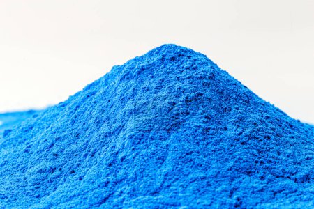 Photo for Blue Fluorescent pigments, made up of a polymeric matrix, resins of different types such as polyester, alkyd, formaldehyde which are fused with organic dyes. - Royalty Free Image